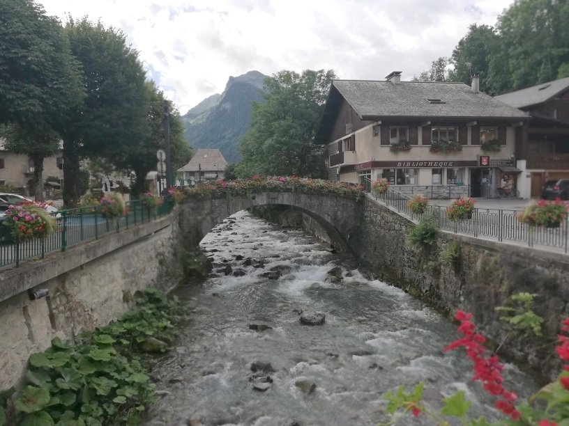 Old bridge over the Dranse in the Alpine village of Morzine