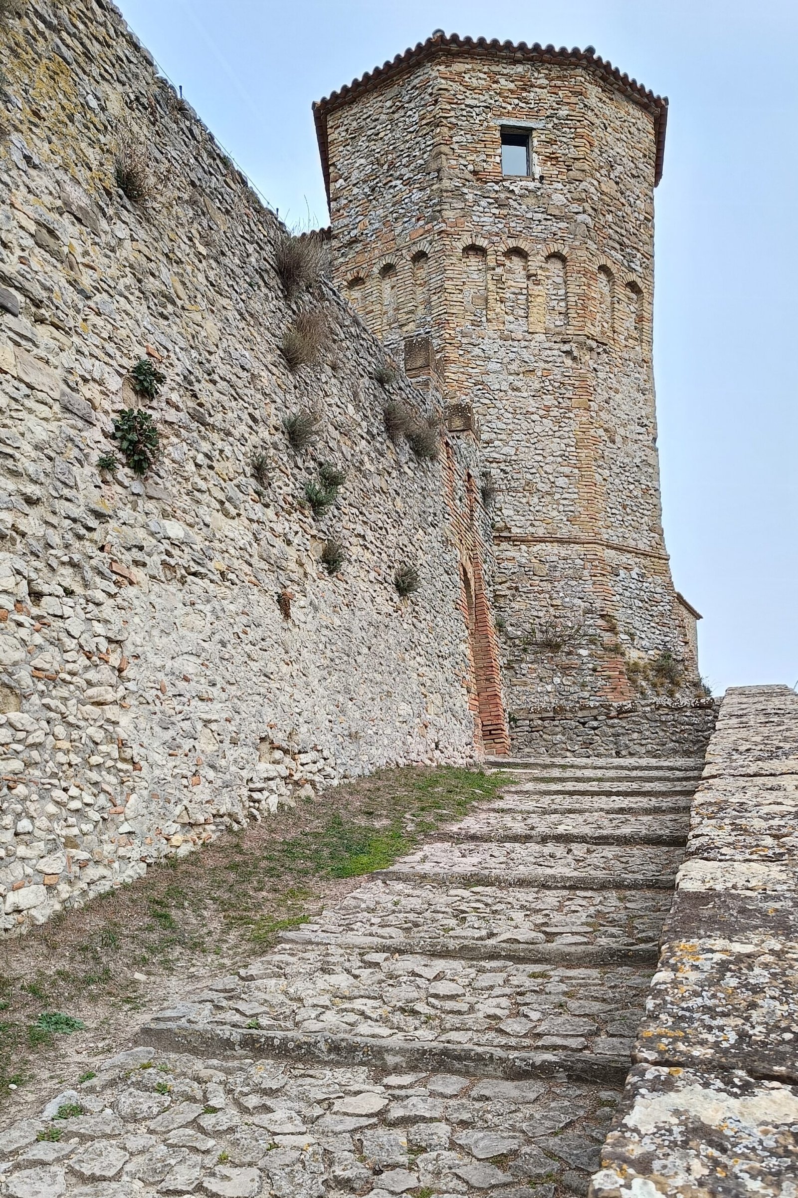 Stone towers and walls of Montebello Castle at Poggio Torriana, home of the Azzurrina legend